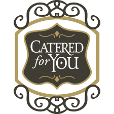 This is an image of a decorative emblem with the phrase "catered for you" written in a stylized font, centered on a black background, and surrounded by an ornate golden frame,