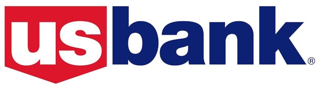The image displays the logo of US Bank, consisting of the words "us bank" in lowercase white letters, placed inside a red and blue shield-shaped design with a white outline, symbolizing their commitment